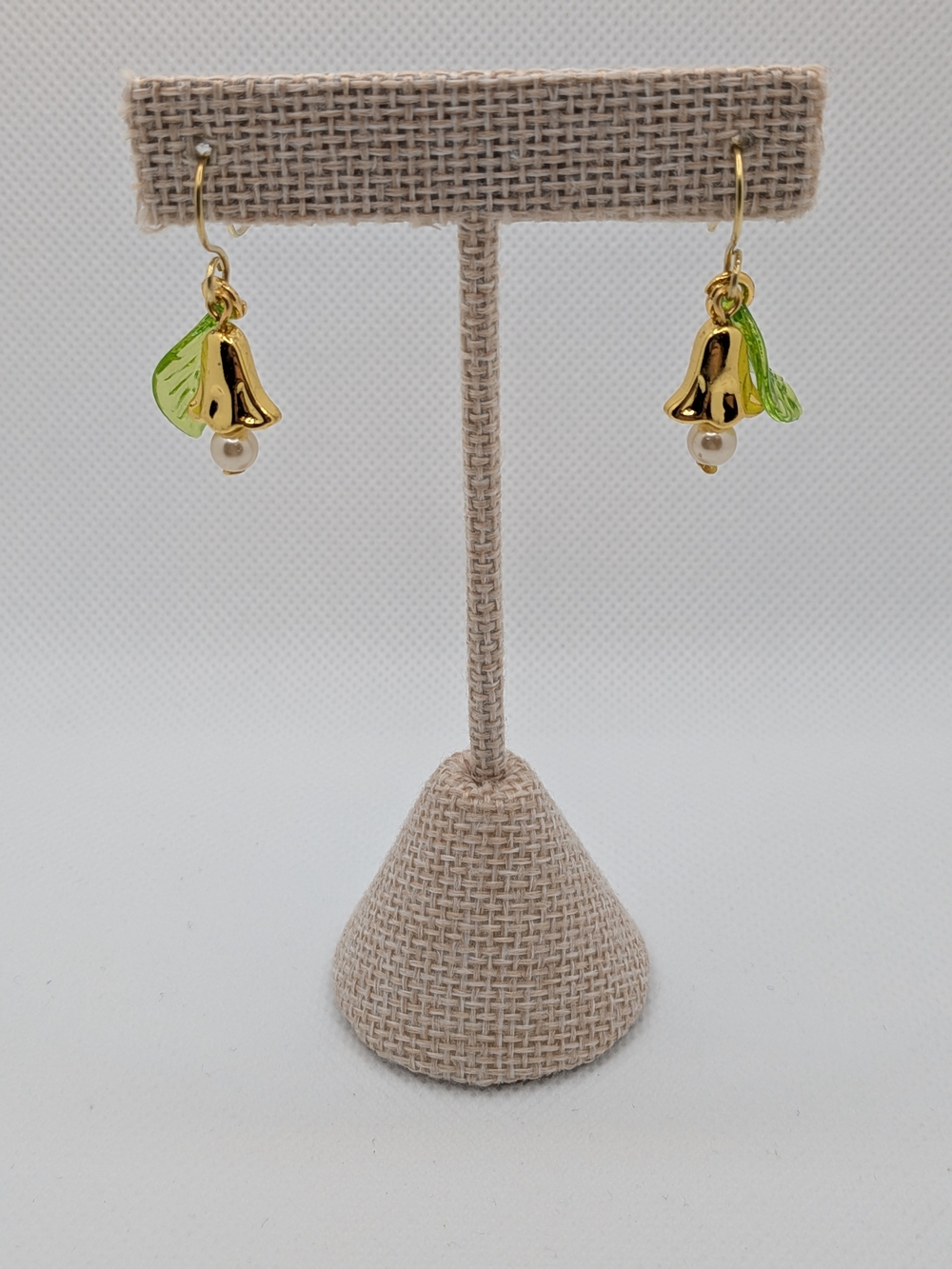 Gold Flower Drop Earrings with Green Leaf and Pearl Accent